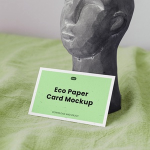 Eco Paper Card Mockup with Statue in Perspective Sight