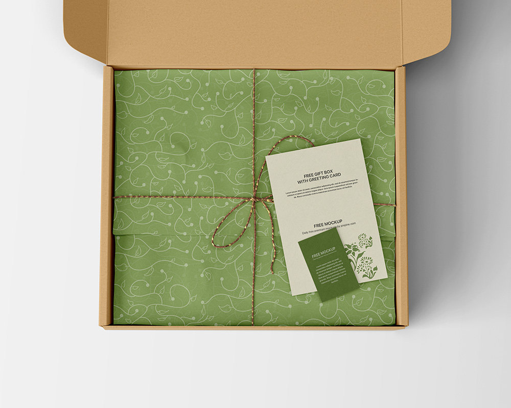 Vista superior de la maqueta de caja de regalo con tarjeta de felicitación